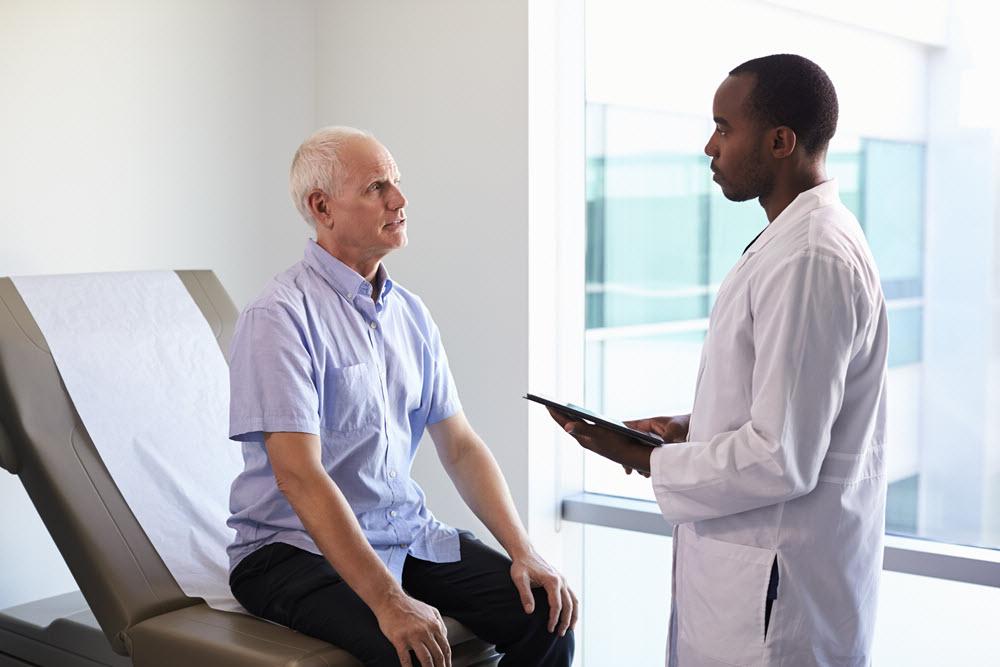 male patient talking to doctor